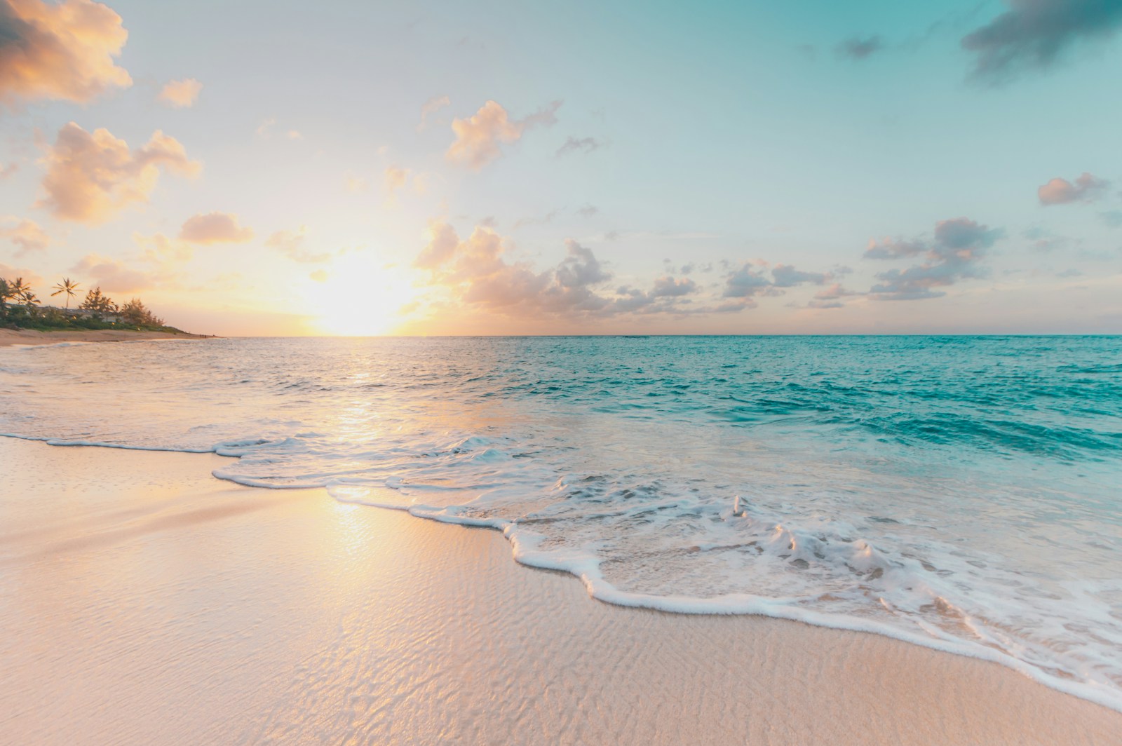 Soft sand and clear turquoise water at a tropical beach